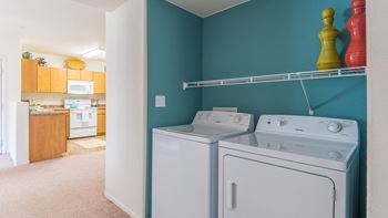 Desert Sands laundry closet with standard washer and dryer. 